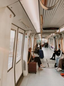 Commuters seated inside a modern train in Copenhagen, Denmark, capturing a moment of urban transport.